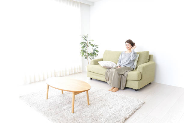 istock Woman pointing to something at home 869944002