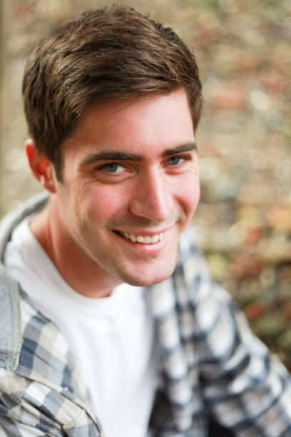 istock portrait of a young man smiling 869950592