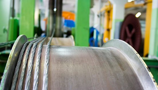 Steel hawser manufacturing process. Hawser on reel is visible closeup.
