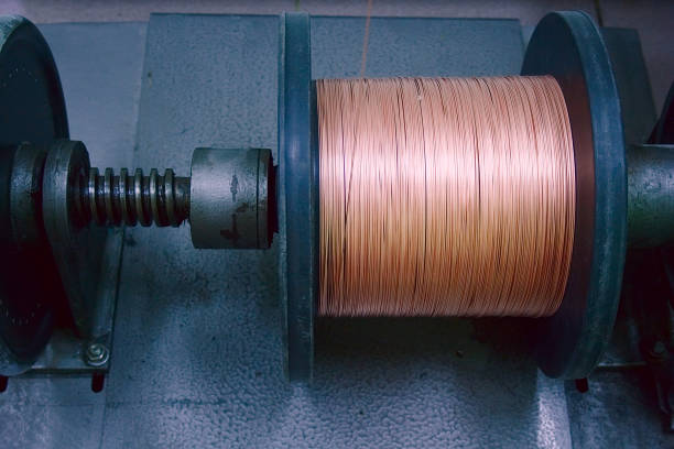istock Cooper wire on a reel at manufacturing. Landscape orientation. 869951036