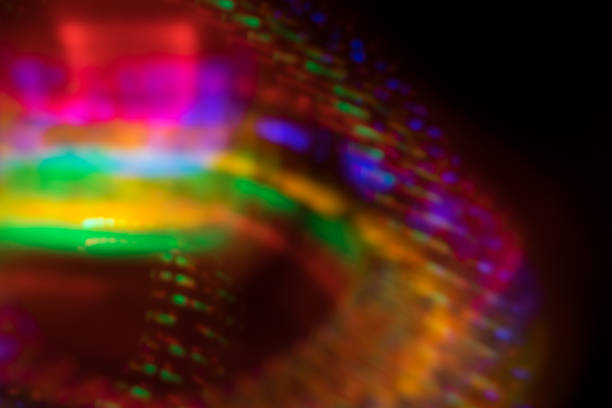 istock Colorful spirals wallpaper abstract light orbs long exposure LED black background 869960312
