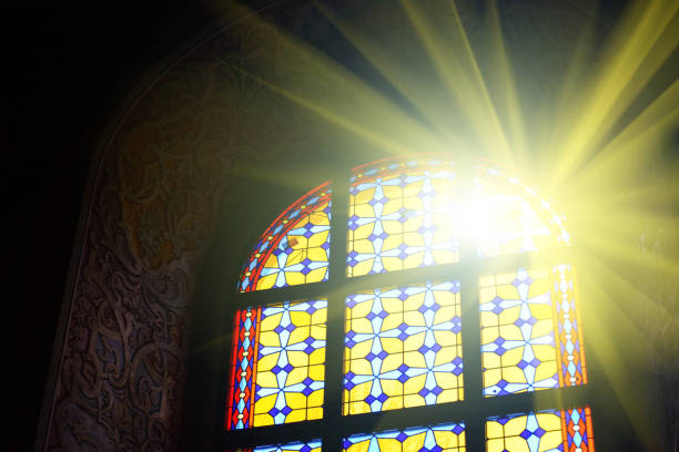 schöne glasfenster mit sonnenlicht - church indoors inside of monastery stock-fotos und bilder