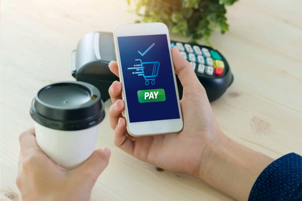 istock Mobile Payment with NFC technology  on Smartphone shopping online with filter effect 869966982