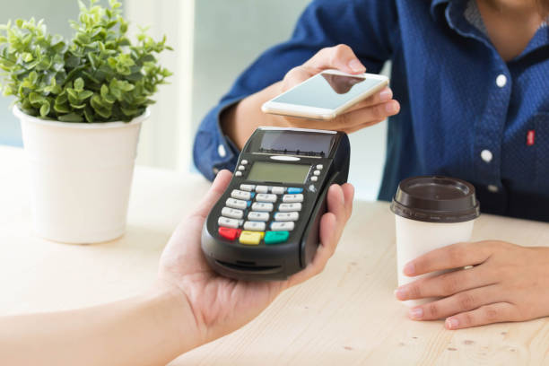 istock Mobile Payment with NFC technology  on Smartphone shopping online with filter effect 869967046