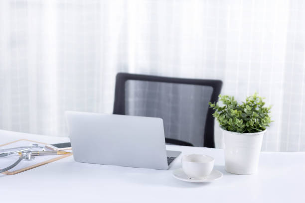 istock image doctor desk office  on many tecnology 869970318