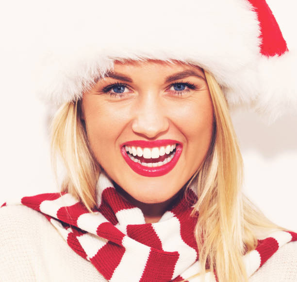 istock Happy young woman with Santa hat 869973650