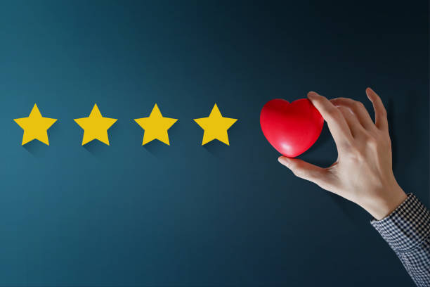 istock Customer Experience Concept, Best Excellent Services Rating for Satisfaction present by Hand of Happy Client put a Heart on Five Star 869978486