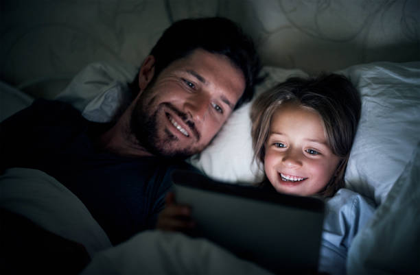 istock Winding down with a digital bedtime story 869981660