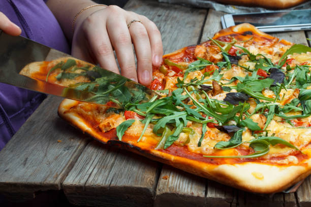 istock Cutting pizza. Homemade pizza. 869984716