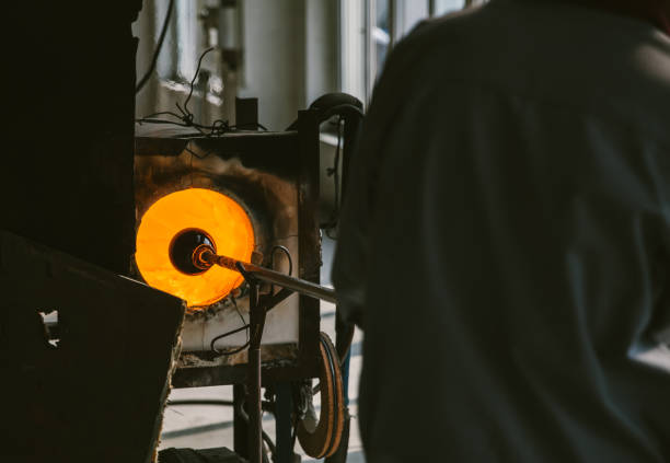 istock Close up of molten glass being shaped before being blown 869996214