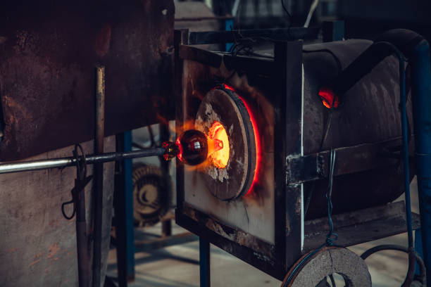 istock Close up of molten glass being shaped before being blown 869996284