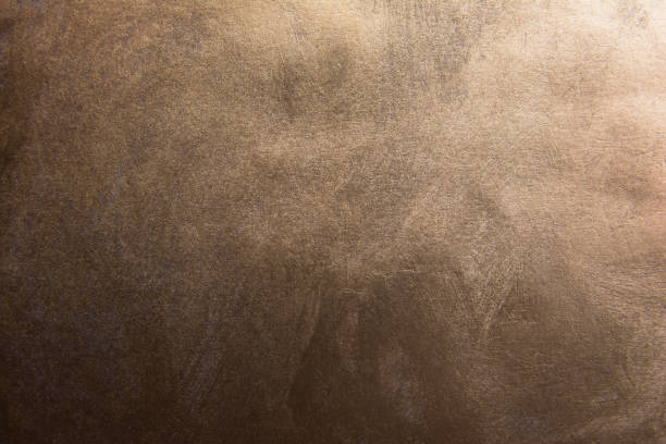 Dark gradient bronze texture background Dark gradient bronze texture background bronze colored stock pictures, royalty-free photos & images