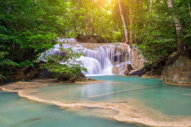 istock Amazing beautiful waterfalls level one in tropical forest at Erawan Waterfall in Erawan National Park, Kanchanaburi Province, Thailand 869998976