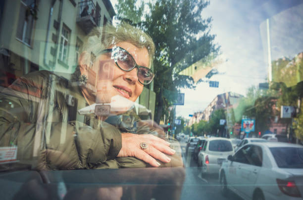 istock Senior woman in the bus 870008814