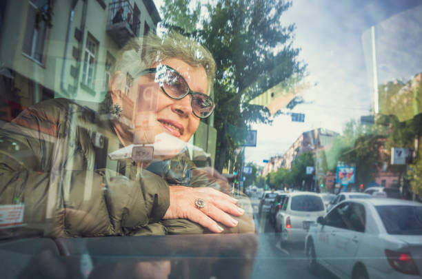 Senior woman in the bus stock photo