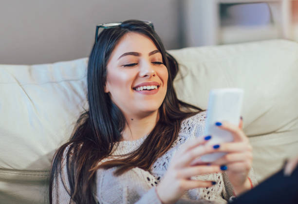 istock Girl reading message in a smart phone 870012038
