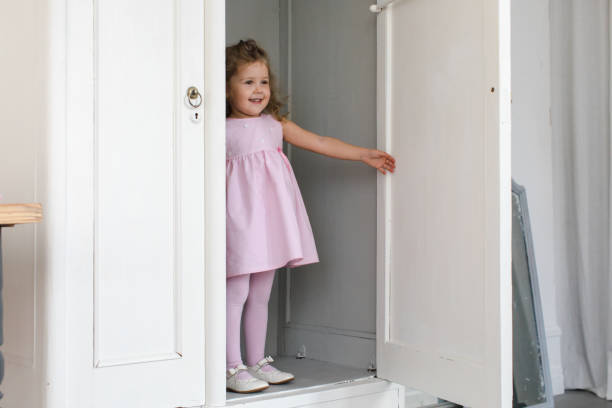 istock Cute girl in closet 870020442