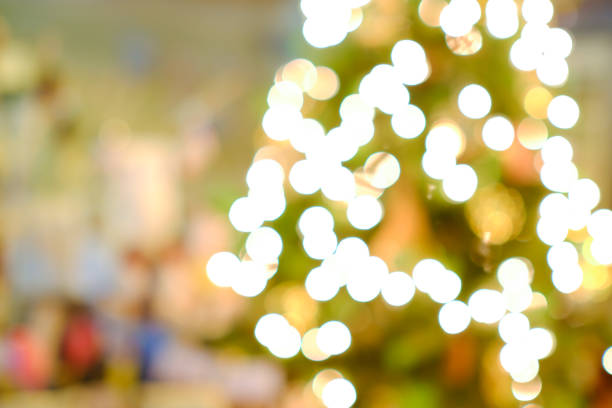 Christmas and New Year concept. Blurred Christmas tree with decorations blurred from the celebration. Can be used for display or montage your products