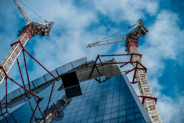 istock Construction of skyscrapers with cranes in London 870027594