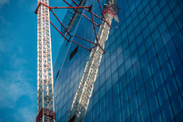 istock Construction of skyscrapers with cranes in London 870027600