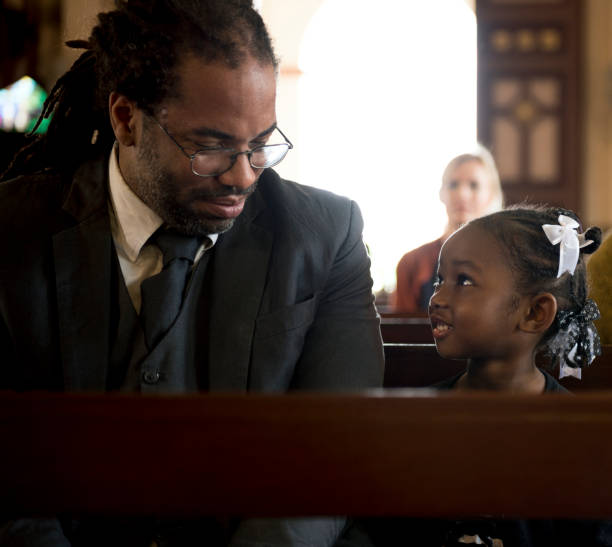Father with her daughter in a church