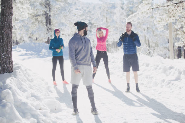 istock Preparation for running on snowy mountain 870049336