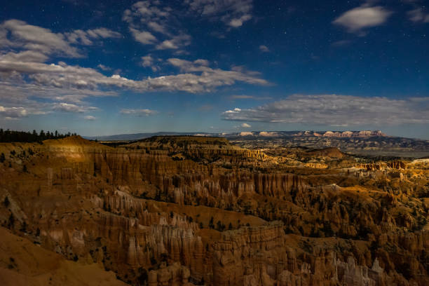istock Night photography Bryce Canyon with moonlight and sky stars and 870057022