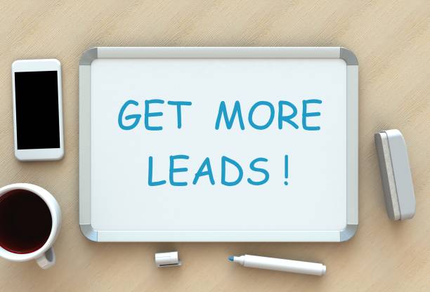 istock Get More Leads, message on whiteboard, smart phone and coffee on table, 3D rendering 870057044