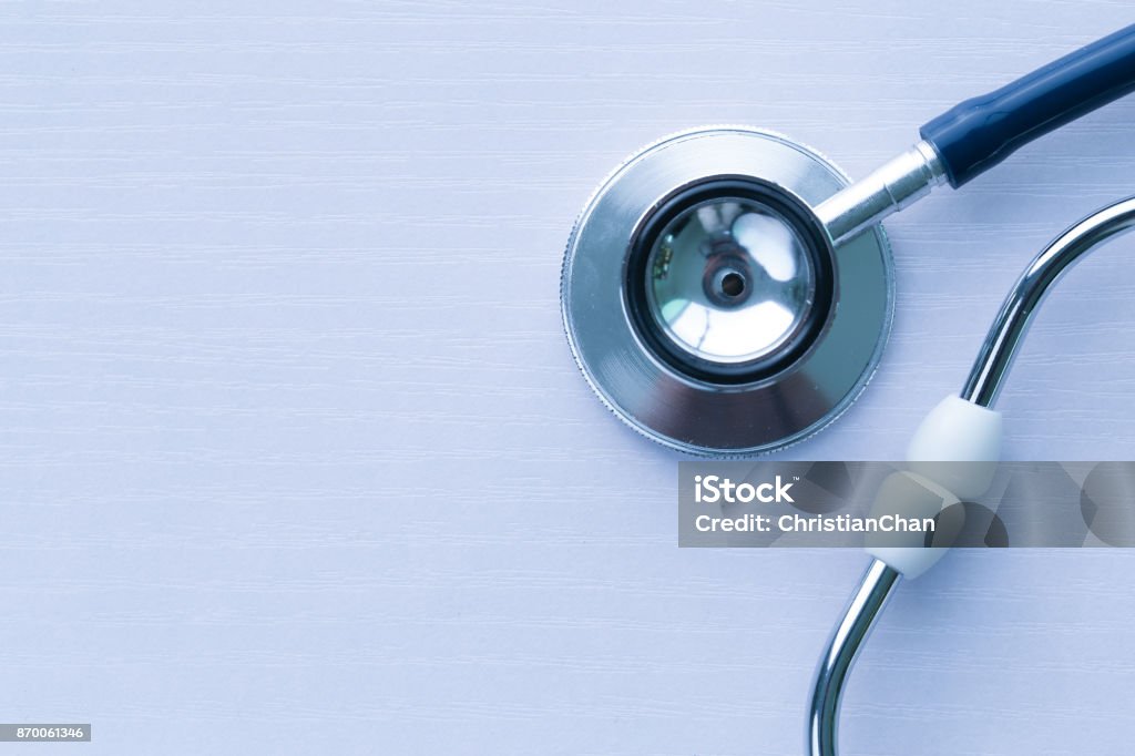 Stethoscope On White Background Close-up shot of stethoscope on table. Abstract Stock Photo