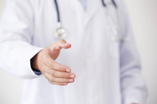 istock Doctor Offering Hand To Shake 870064224