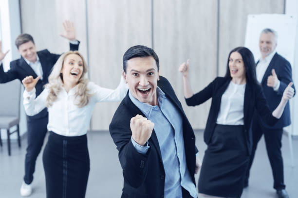 istock Successful male person making strong fist 870065552