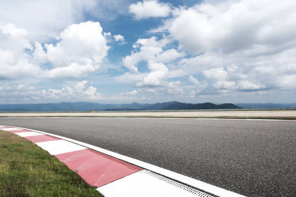 istock empty asphalt road with green hill in cloud sky 870080776