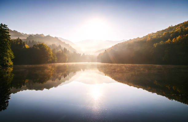 istock Sunrise on the lake in autumn nature. 870080912