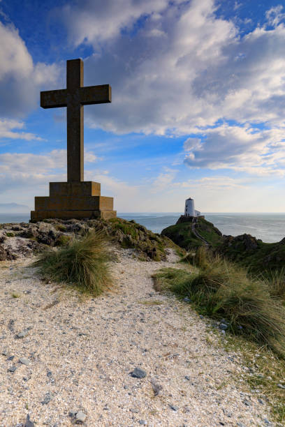 istock Celtic cross of Llanddwyn Island 870084108