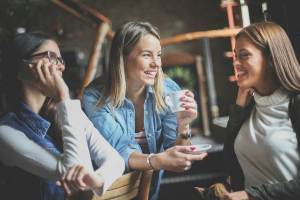 istock Young girls having fun in cafe. Close up. 870088032