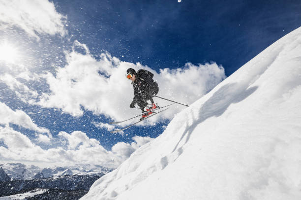 Backcountry skier jumping Backcountry skier jumping extreme skiing stock pictures, royalty-free photos & images