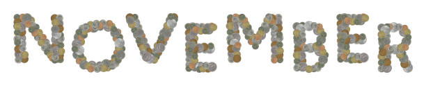 istock NOVEMBER word with old coins on white background 870091038