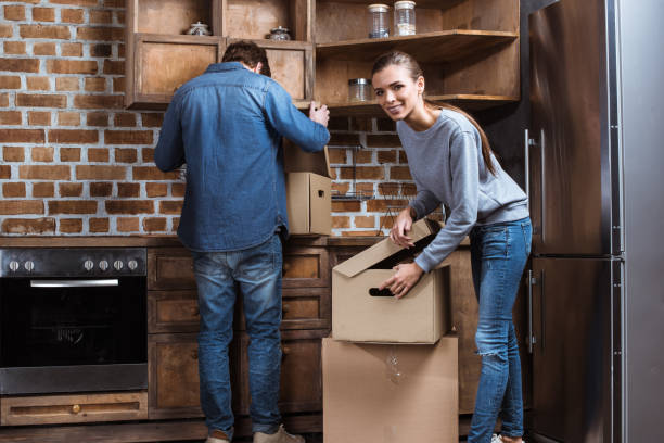 istock couple unpacking stuff at new home 870095258