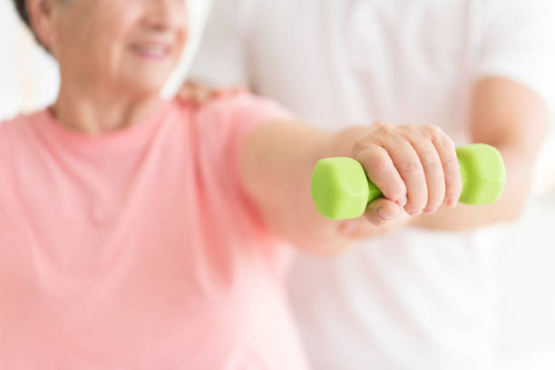 istock Close-up of person with dumbbell 870095822