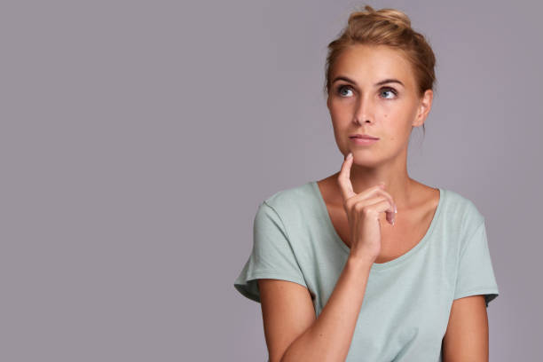 istock Casual pretty woman thinking. Isolated 870102656