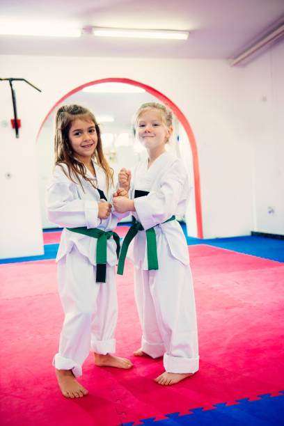 istock Determined girls on sports training in kimonos 870105858