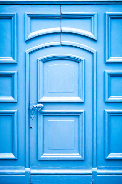 Blue Wooden Door Old wooden door. Cracked door. No people blue front door stock pictures, royalty-free photos & images