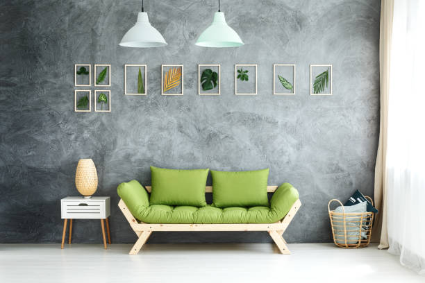 istock Pastel lamps above green sofa 870114566