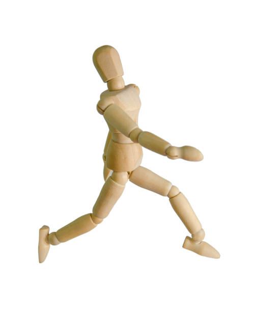 istock wooden figure mannequin running isolated on white 870126200