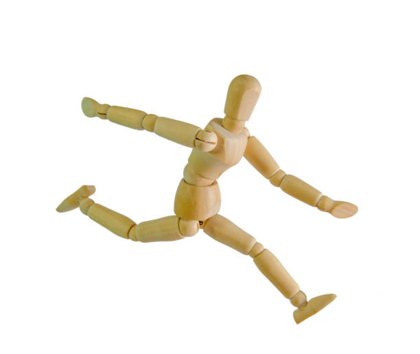 istock wooden figure mannequin running isolated on white 870126220