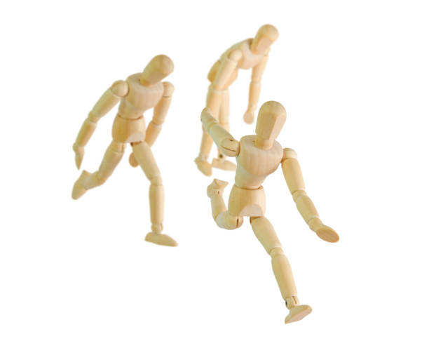istock wooden figure mannequin running isolated on white 870127002