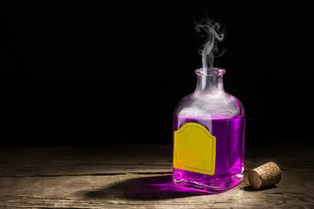 Glass vial with a purple potion on a dark background. Magic elixir. Copy space for text. 3D rendering