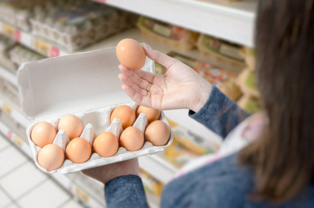 istock Woman buys eggs in the supermarket 870141992