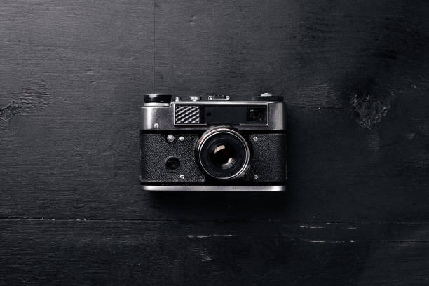 istock Camera retro. On a wooden surface. Top view. Free space for your text. 870142284
