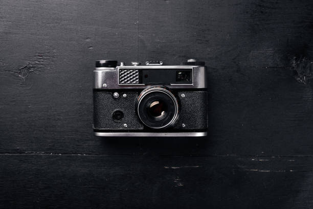 istock Camera retro. On a wooden surface. Top view. Free space for your text. 870144842
